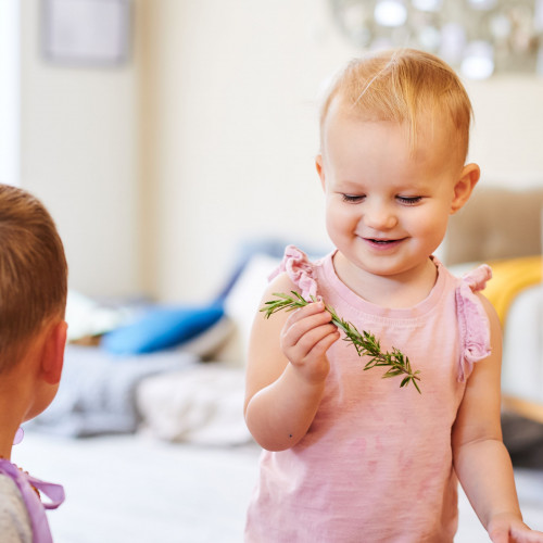 Young child exploring natural sensory