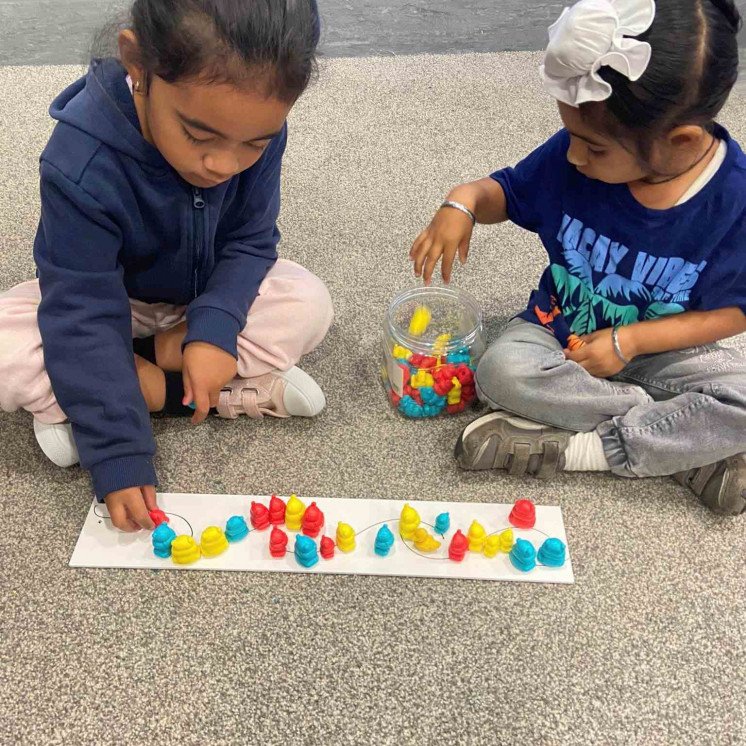 Busy Bees Alfriston Road kindergarten children focused on learning through play