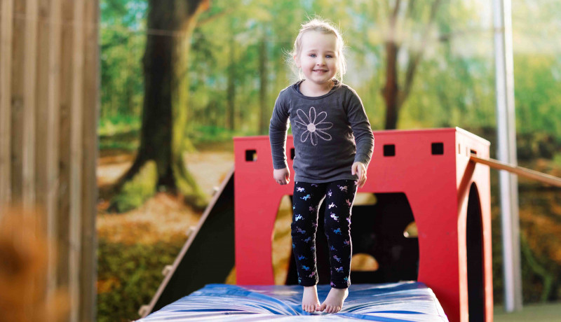 Girl jumping Busy Bees Early Learning Centre Church Street Palmerston North