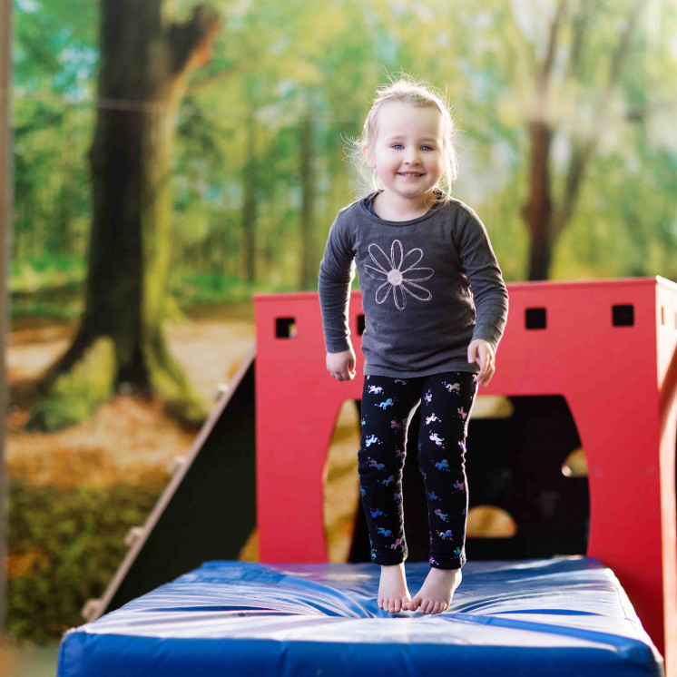 Preschool girl playing outside at Busy Bees Church Street early childhood learning centre