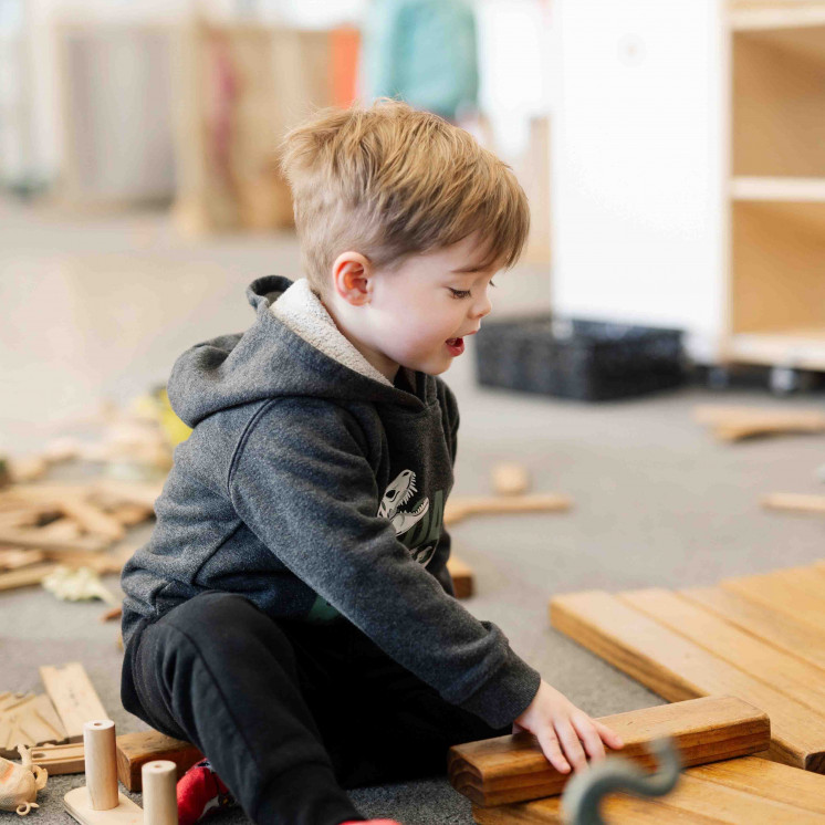 Boy playing inside at Busy Bees Church Street early childhood learning centre