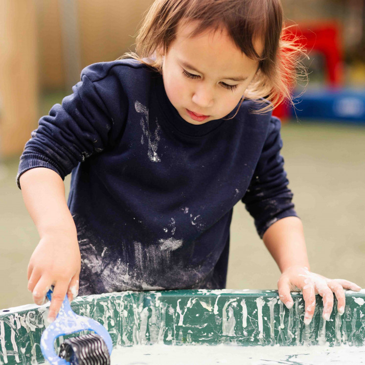 Child enjoying sensory play of early childhood centre in Palmerston North at Busy Bees on Church Street
