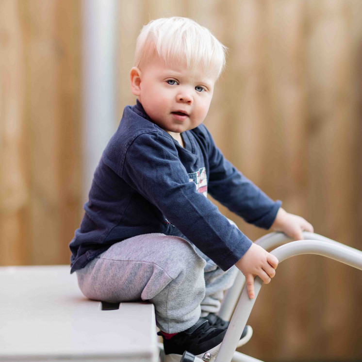 Little boy at the playground of early childhood centre in Palmerston North at Busy Bees on Church Street