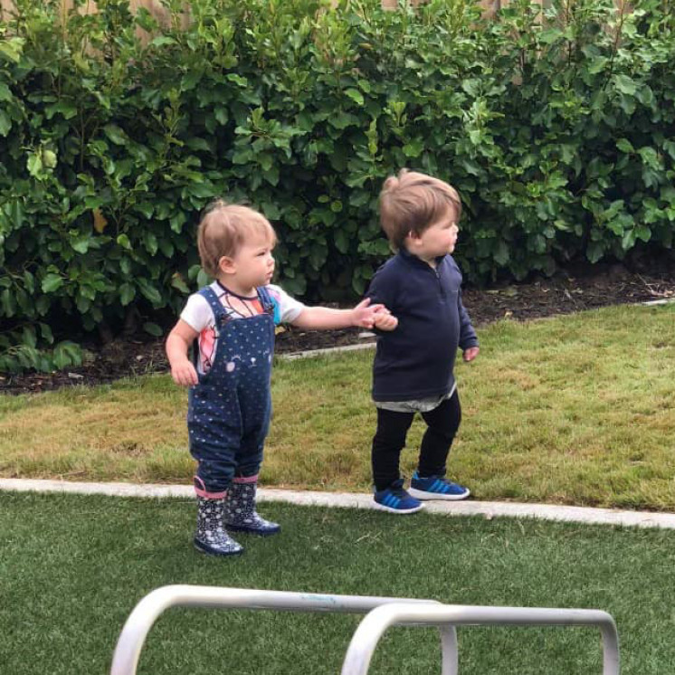 girl and boy playing outside at Busy Bees Church Street early childhood learning centre