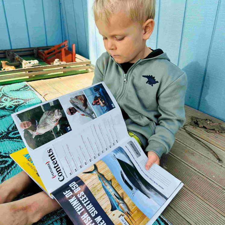 Busy Bees Coopers Beach boy reading book 
