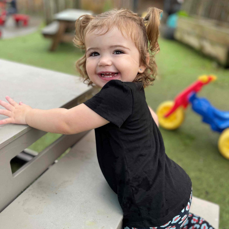 Busy Bees Dargaville - Toddler climbing on playground