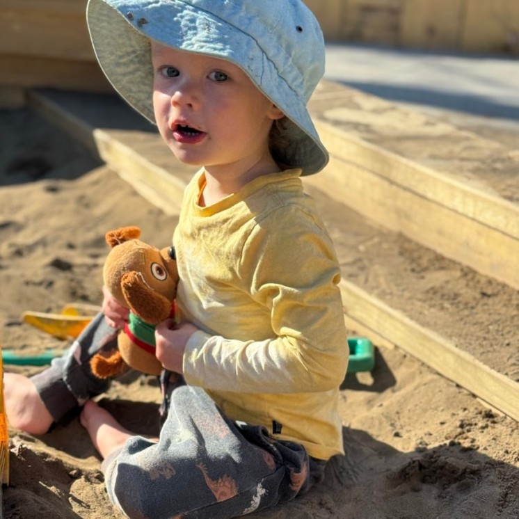 Busy Bees Greytown childcare centre toddlers out in sandpit