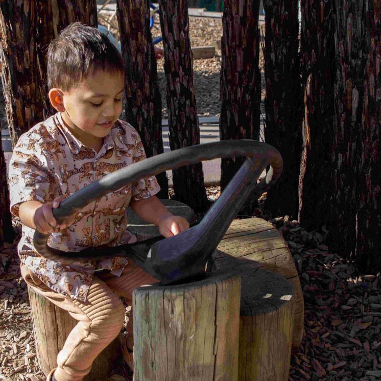 Young boy immersed in imaginary play at Busy Bees Hastings