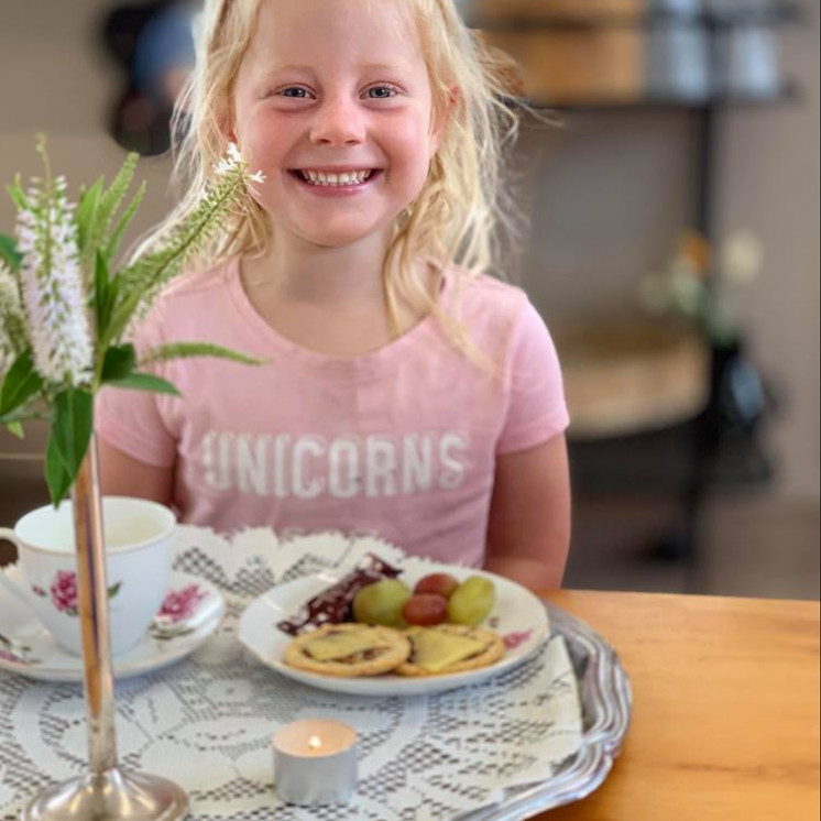 Girl enjoying a special morning tea at Busy Bees Napier Road