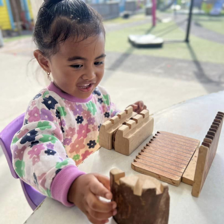 Young girl playing inside at Busy Bees Ormiston Road