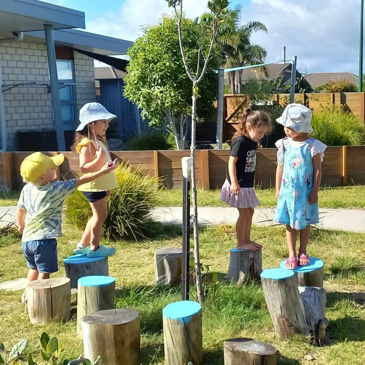 Climbing/Hopping around outside at Busy Bees Papamoa Beach
