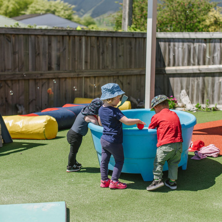 Busy Bees Richmond children enjoying water play in the sunshine