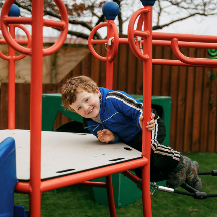 Busy Bees Southbrook kid playing on playground