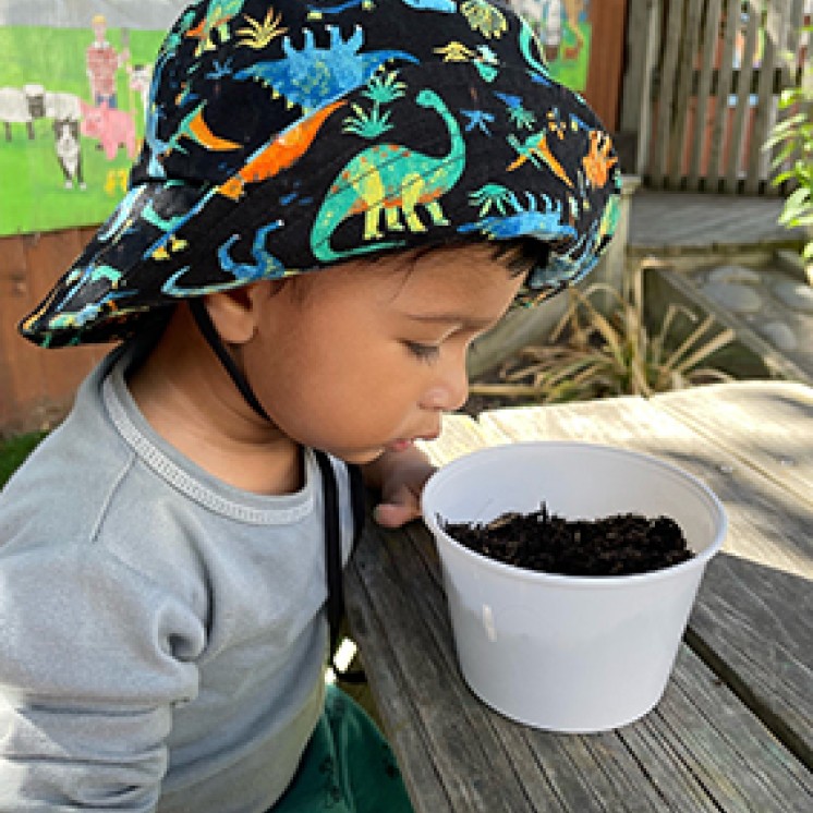 Busy Bees Southbrook child playing with dirt