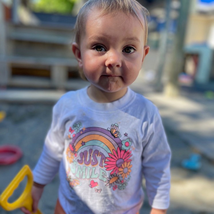 toddler playing in sandpit at Busy Bees Southbrook