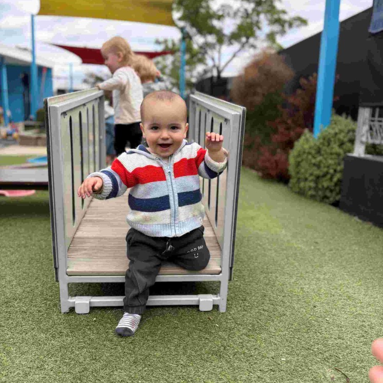 Baby boy in Nursery playground at Busy Bees Stoke