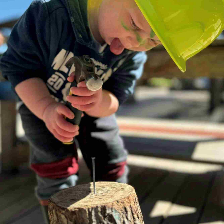 Preschool boy engaged in building at Busy Bees Taupo