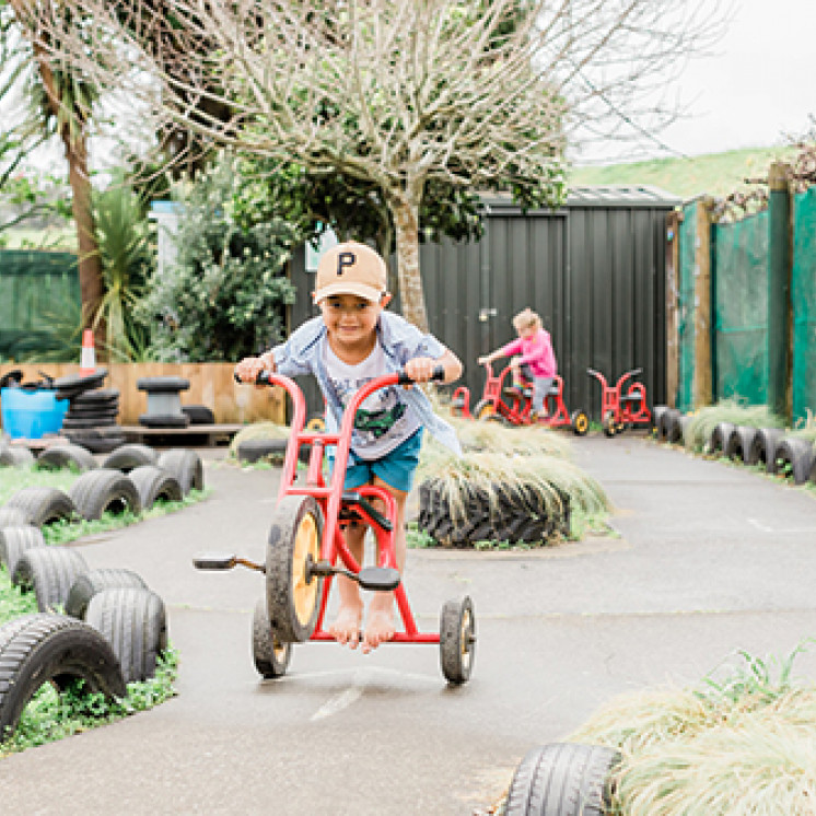 Doing tricks on bikes at Busy Bees Waitara