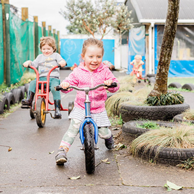 Bike races with friends at Busy Bees Waitara