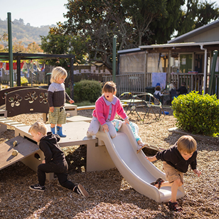 Kids outside on playground at Busy Bees Western Heights
