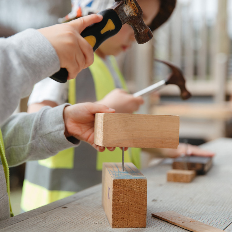 Building with blocks and nails at Grey Lynn Montessori by Busy Bees 