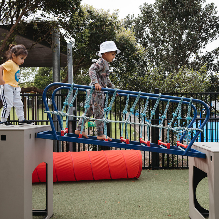 Climbing around the playground at Grey Lynn Montessori by Busy Bees