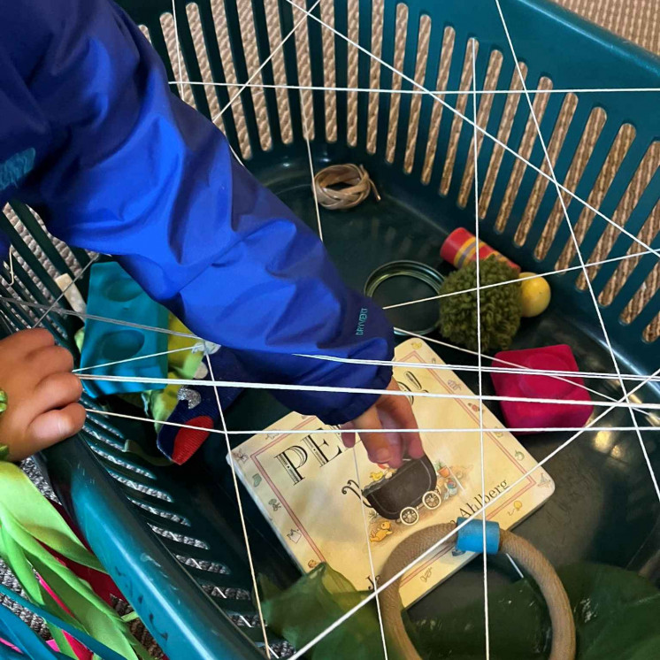 Curiosity in full swing with this spider web discovery basket at Busy Bees Hardy Street