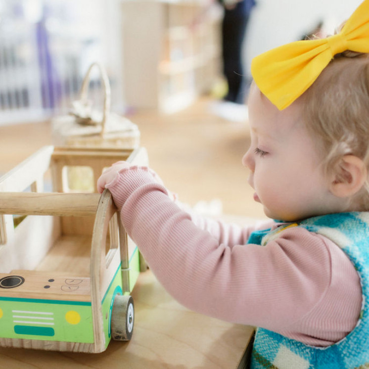 Nursery child with natural resources at Silverstream Early Learning by Busy bees